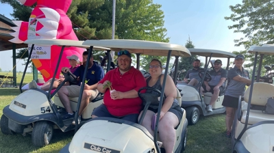 People in Golf Caddy Photo