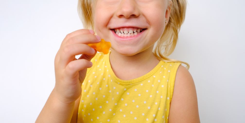 Child holding Gummy Bear