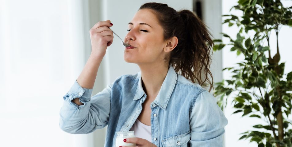 Woman Eating Yogurt