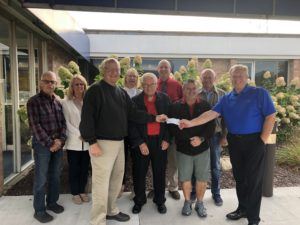 Pictured front row (l to r) is Joe Nartker, Ken McLaren, Mark Navarro, and Steve Barnett, McKenzie CEO / President. Back row (l to r) is Grant Carmen, Tracy Palmateer, Lyn Mossett, Paul Flynn, and Larry Leveille