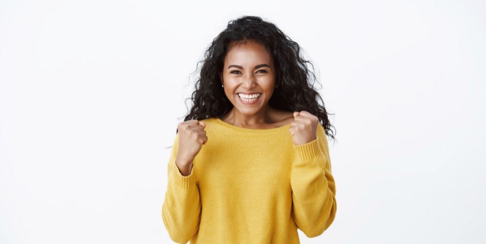 Happy Woman in Yellow Sweater