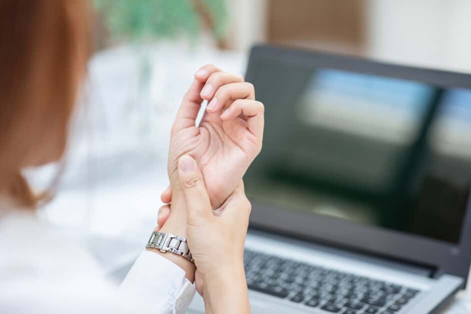 woman feeling her wrist