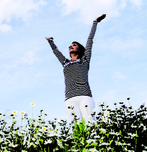 woman standing with hands up