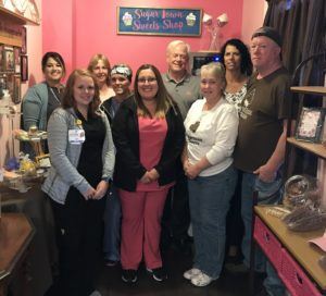 Front row (l to r): Morgan Fraley, RN; Madeline Saldana, CST; Sandy and Scott Edgley. Back row (l to r): Billi Jo Hennika, Chief Operating Officer; Patty Schafsnitz, Director of Nursing; Katie Krueger, RN; Steve Barnett, President and CEO; and Amy Ruedisueli, Chief Financial Office