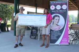 Pictured: Wil Morris, Sanilac County CMH Executive Director, presents a check for employee donations during “Casual for a Cause” to Rebecca Cambridge, McKenzie Auxiliary President.