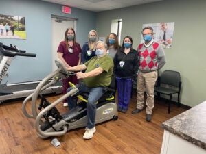 Jennifer Anderson, BS, RRT; Trisha Perry, BAS, RRT; Kathleen Ross, RRT; Erin Lipka, BAS, RRT, Cardiopulmonary Manager; and James L. Sams, MD, Program Medical Director. Seated, Harry Badrak, Cardiac Rehab patient.