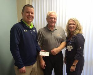 Sandusky Lions Club Donates (l to r): Sam Barnett, Sandusky Lions Club President; Steve Barnett, McKenzie President / CEO; and Nina Barnett, McKenzie Foundation Manager